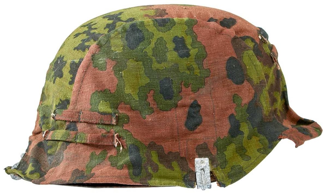 A GERMAN WAFFEN SS MAN'S M1942 TYPE HELMET AND COVER,: the steel skull with dark grey painted finish and decal to the right side, slightly worn, good late war liner with original lace and size stamped 57, original chin strap dated 44, stamped 1571 on the