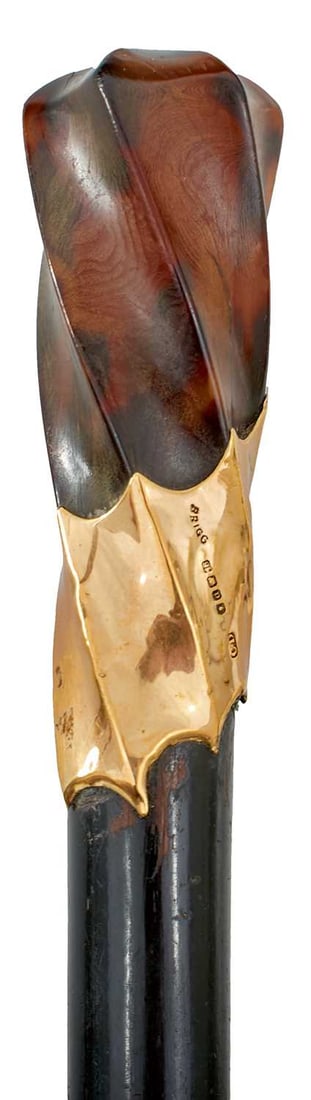A GOOD 19TH CENTURY 18CT GOLD MOUNTED WALKING STICK BY BRIGG,: the wrythen carved horn handle mounted in 18ct gold hallmarked London 1899, with maker's mark CD (probably for Charles Henry Dumenil, inscribed BRIGG and with the owner's name E.G.B. Gell, tapering