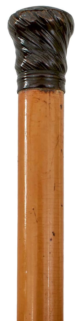 AN EARLY 19TH CENTURY SWORD STICK,: 77cm partially fullered flattened diamond section blade, spirally lobed pommel, malacca haft with click opening, long metal ferrule, 115.5cm long over all. Some splits.