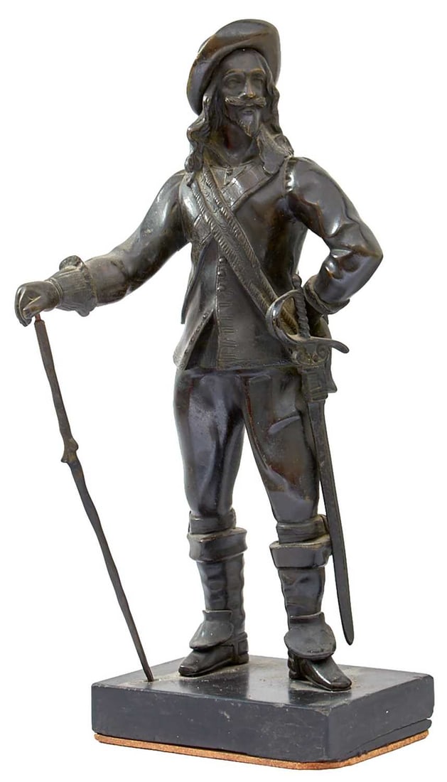 IN THE MANNER OF CHARLES POITEVIN,: a bronze full length figure of a Civil War era cavalier, (possibly Charles I), on plinth base, 34.5cm high over all. Some damage.