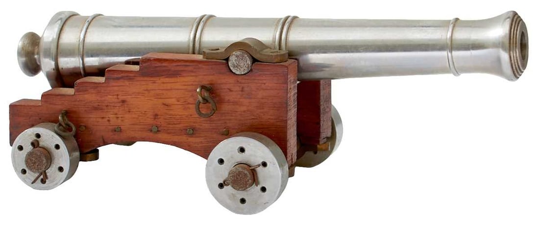 A MODEL OF A BRITISH 12-POUND NAVAL CANNON,: 8.5inch five-stage barrel with plain trunnions and bun-shaped cascabel, brass and steel trimmed stepped wheeled carriage.