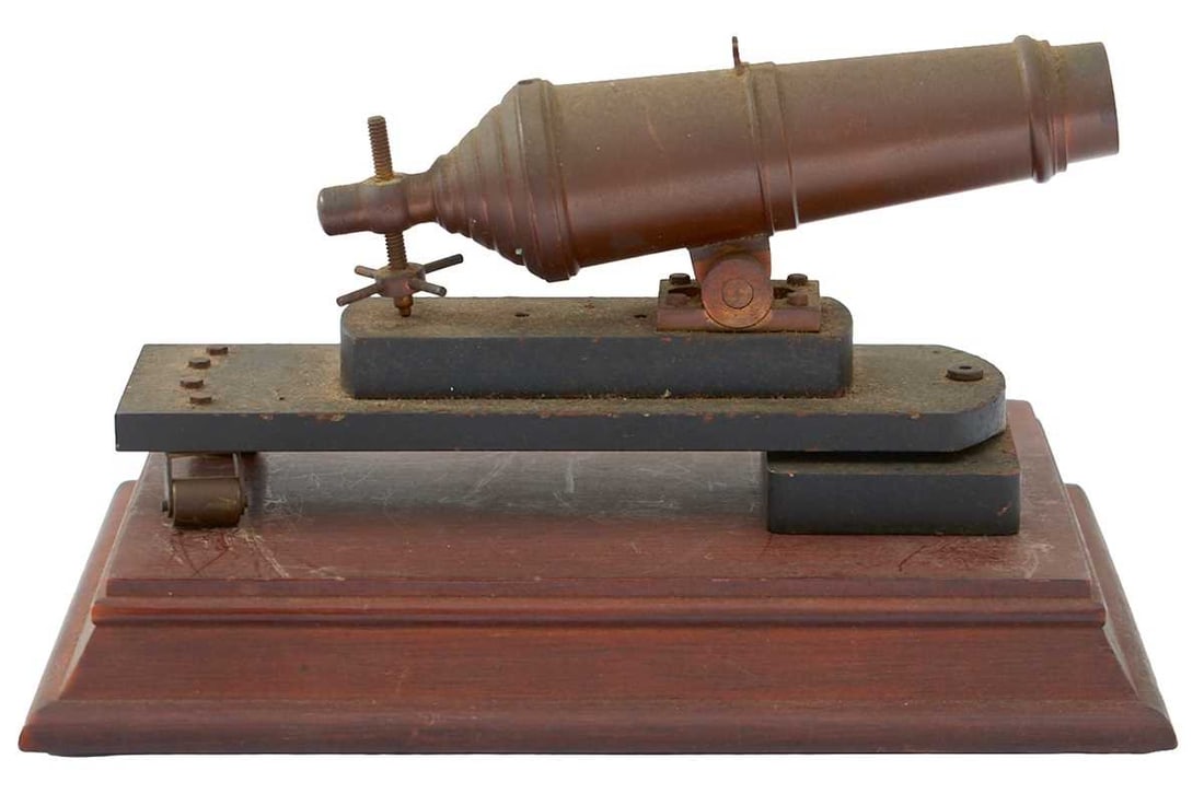 A 19TH CENTURY BRONZE MODEL OF A CARRONADE,: 4.75inch three-stage sighted barrel, mounted on its pivoting slide and then on a stepped wooden display plinth.