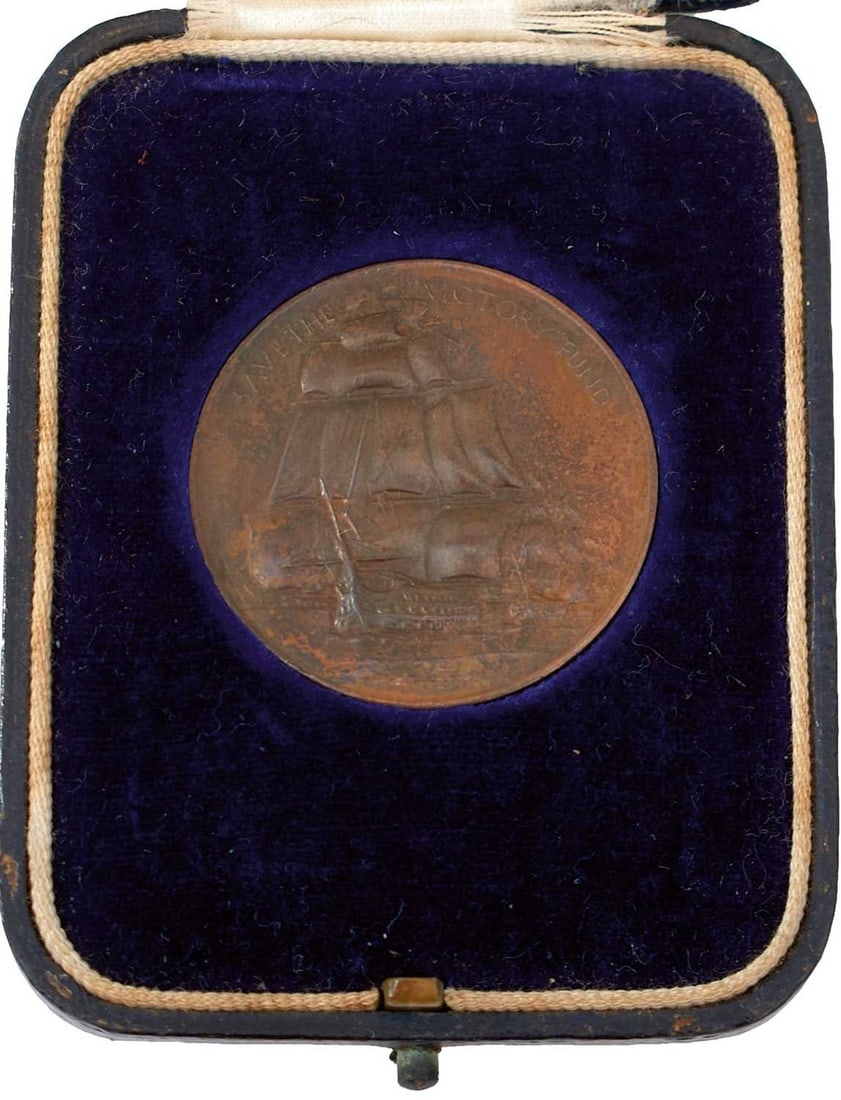 OF NELSON INTEREST AN HMS VICTORY COPPER MEDALLION,: in its case, marked 1797 Copper Taken from HMS Victory 1924.
