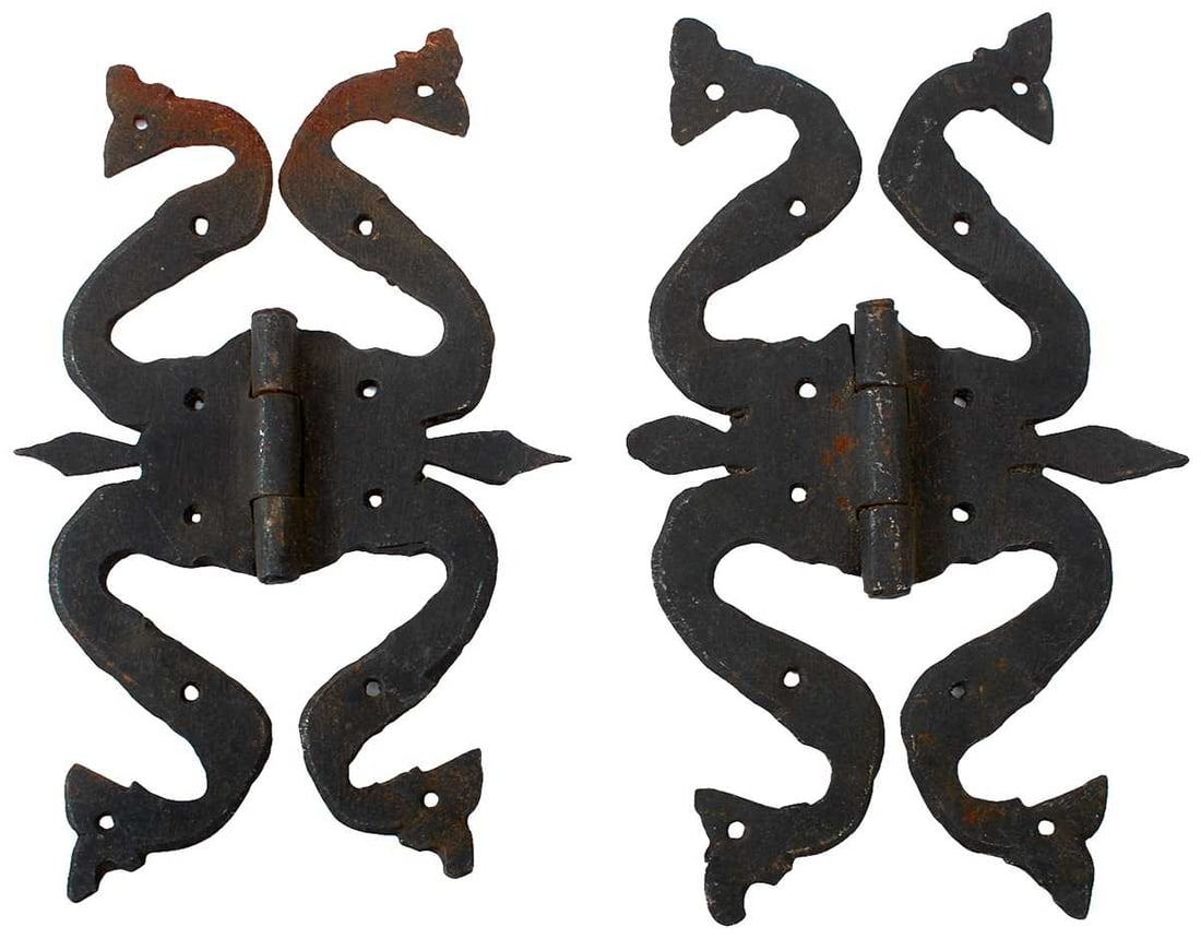 A PAIR OF LARGE MEDIEVAL STYLE IRON DOOR HINGES,: from Temple Farm, Aslackby, Lincs, in the form of dragons with striking heads, 12cm x 19cm. Later painted black. Old parchment label inscribed "From the Temple Aslackby Lincolnshire believed to have