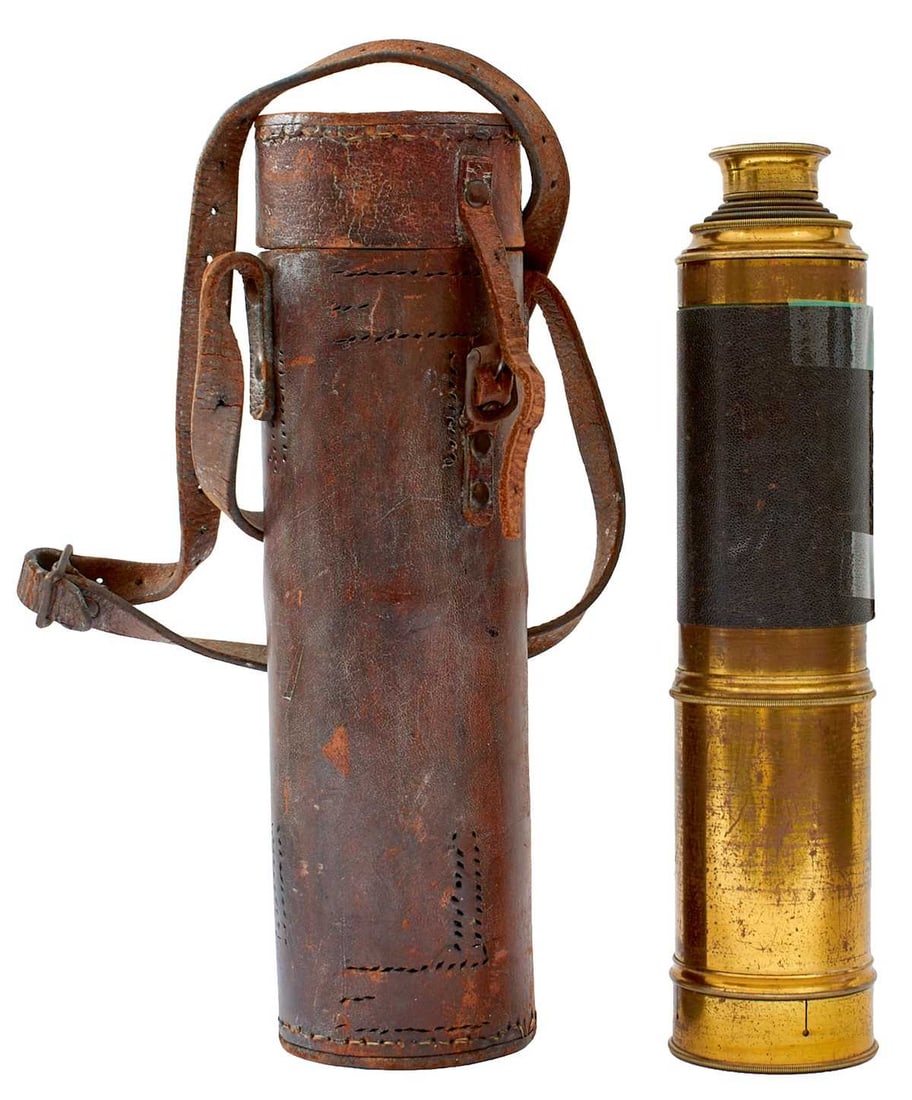 A LARGE 19TH CENTURY FOUR-DRAW TELESCOPE,: the lacquered brass body with leather cover, stitching parted, sliding eye aperture cover, lacquered brass lens cover in its tin lined leather transit case. Probably Boer War period.