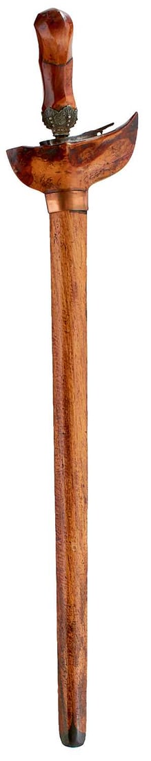 A LATE 19TH OR EARLY 20TH CENTURY INDONESIAN PANJANG OR EXECUTIONER'S KRIS,: A LATE 19TH OR EARLY 20TH CENTURY INDONESIAN PANJANG OR EXECUTIONER'S KRIS, 47.5cm fullered shaped blade, characteristic wooden hilt with chiselled steel collar, in its wooden scabbard.
