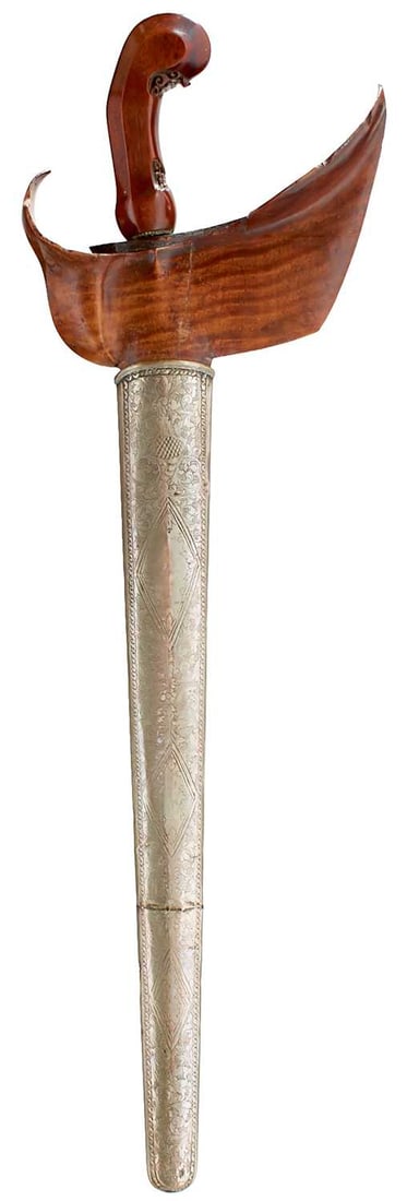 A 19TH CENTURY INDONESIAN KRIS,: A 19TH CENTURY INDONESIAN KRIS, 37cm wavy pamor fullered blade, characteristic carved wooden hilt decorated with scrolling foliage, in its white metal wrapped wooden scabbard decorated with scrolling 