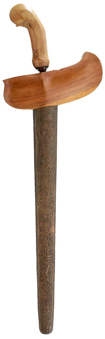 A 20TH CENTURY INDONESIAN KRIS,: A 20TH CENTURY INDONESIAN KRIS, 36.5cm wavy pamor blade, characteristic bleached wood hilt decorated with scrolling foliage, filigree collar set with coloured stones, in its brass wrapped wooden scabb