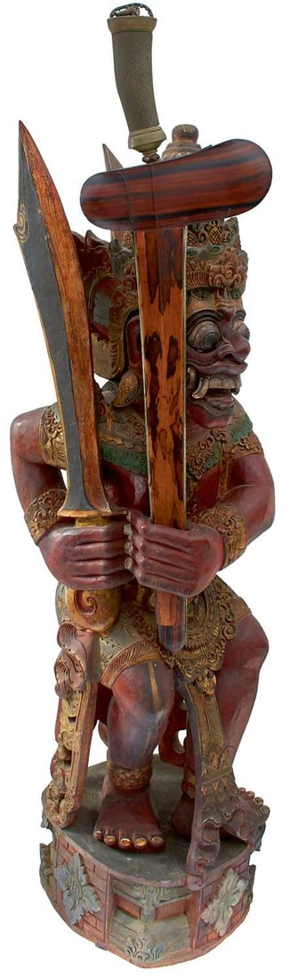A GOOD LATE 19TH CENTURY INDONESIAN (BALI) RAWANA KRIS STAND,: A GOOD LATE 19TH CENTURY INDONESIAN (BALI) RAWANA KRIS STAND, the 91cm high wooden figure carved from a single piece of wood in the form of Rawana and finished in polychrome paints, clutching a Baline