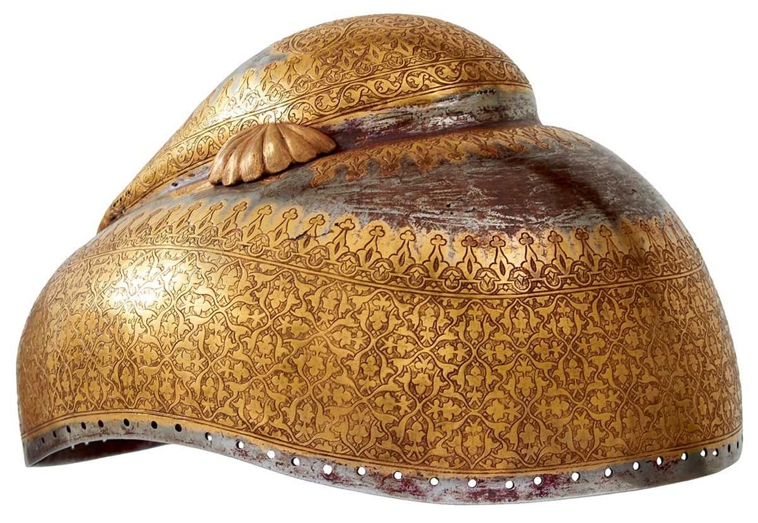 A MID TO LATE 19TH CENTURY INDIAN SIKH TURBAN HELMET,: A MID TO LATE 19TH CENTURY INDIAN SIKH TURBAN HELMET, three-piece stepped skull of characteristic form, the upper dome finely chiselled with scrolling foliage and vines within geometric borders and fl