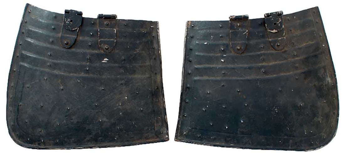 A PAIR OF PIKEMAN'S TASSETS IN THE 17TH CENTURY STYLE,: A PAIR OF PIKEMAN'S TASSETS IN THE 17TH CENTURY STYLE, each with turned rim and narrow gulley, embossed to simulate five articulated lames. Black painted.