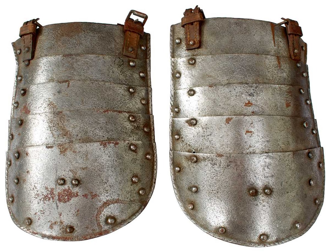 A PAIR OF TASSETS,: A PAIR OF TASSETS, each comprising of five lames with turned edges, leather straps with buckles.