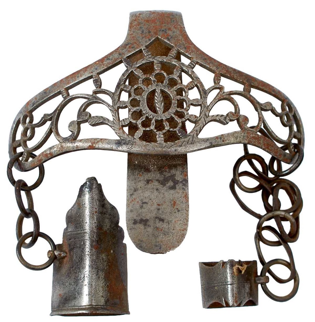 AN 18TH CENTURY CUT STEEL SMALLSWORD HANGER,: AN 18TH CENTURY CUT STEEL SMALLSWORD HANGER, the curved and shaped clip pierced with scrolling foliage and with a central circular form pierced with foliage to match, faceted suspension rings retainin