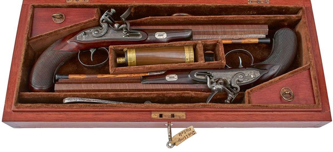 A LATER CASED PAIR OF 38-BORE FLINTLOCK DUELLING PISTOLS BY MORTIMER,: A LATER CASED PAIR OF 38-BORE FLINTLOCK DUELLING PISTOLS BY MORTIMER, 10.25inch sighted rebrowned damascus barrels engraved with foliate sprays at the platinum lined breeches, the latter inlaid with p