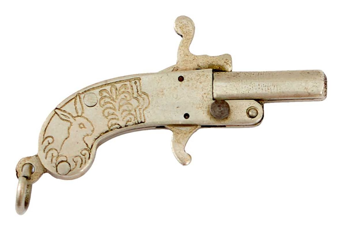 AN EARLY 20TH CENTURY 1MM PINFIRE PISTOL,: AN EARLY 20TH CENTURY 1MM PINFIRE PISTOL, 0.5inch octagonal plated barrel, scroll engraved plated action and grips, exposed trigger, the butt with lanyard ring.
