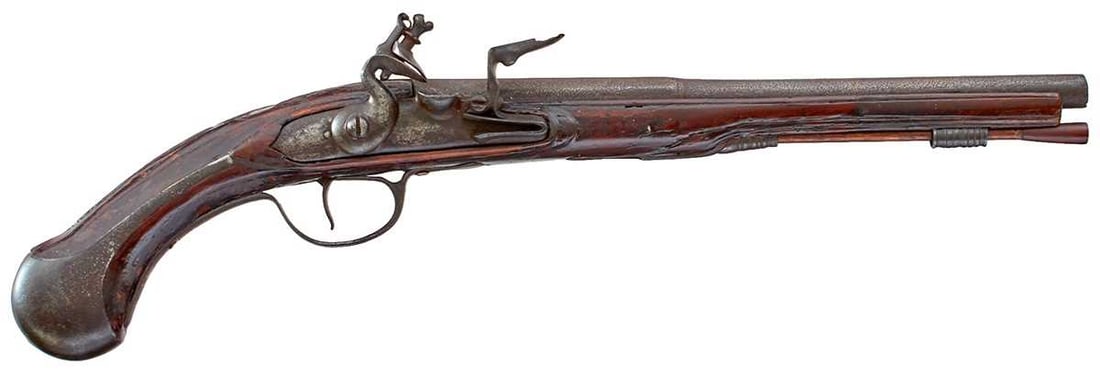 A 32-BORE LATE 17TH OR EARLY 18TH CENTURY HOLSTER PISTOL,: A 32-BORE LATE 17TH OR EARLY 18TH CENTURY HOLSTER PISTOL, 11.25inch two-stage barrel, bevelled lock, full stocked carved about the iron mounts, long eared butt cap, later wooden ramrod.