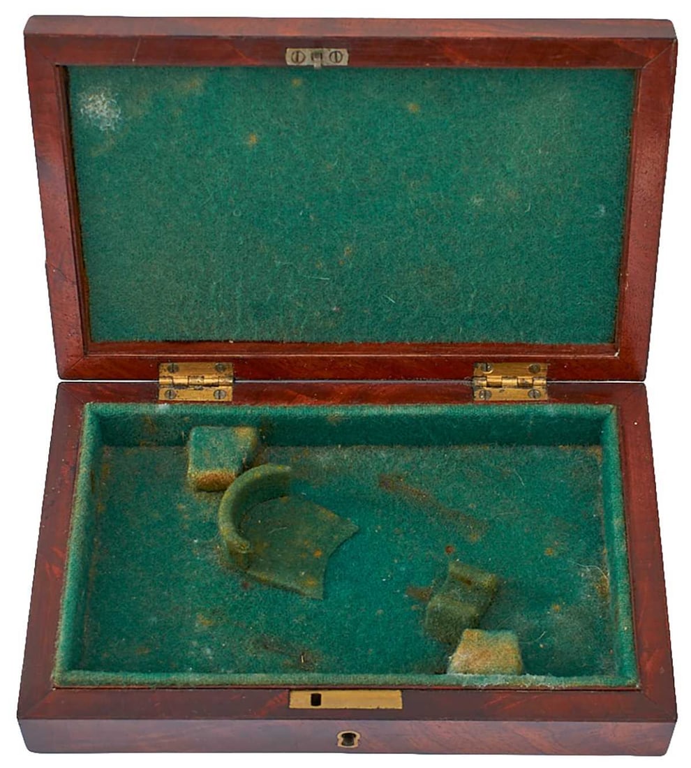 A SMALL MAHOGANY CASE,: A SMALL MAHOGANY CASE, the green baize lined case, veneer loss to left side of lid, together with a marquetry box of book-form later fitted for pistols. (2)