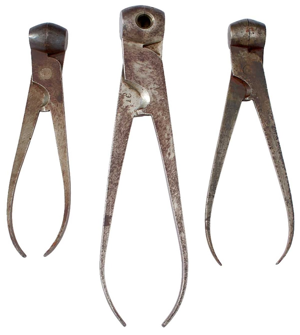 A GROUP OF FOUR SCISSOR BALL MOULDS,: A GROUP OF FOUR SCISSOR BALL MOULDS, of characteristic steel scissor form, each with sprue cutter, 48-bore, 32-bore, 16-bore and 50-bore (4)