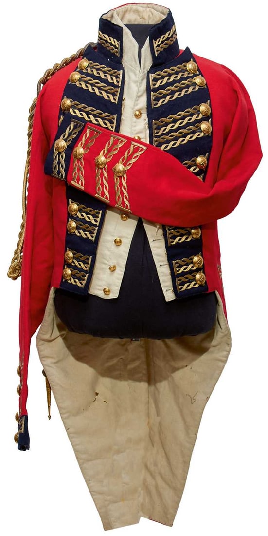 THE GENERAL OFFICER'S COATEE OF GENERAL SIR DAVID BAIRD GCB WORN WHILE GOVERNOR OF KINSALE,: THE GENERAL OFFICER'S COATEE OF GENERAL SIR DAVID BAIRD GCB WORN WHILE GOVERNOR OF KINSALE, the red cloth body with blue collars and facings, all trimmed in braided bullion gold twist, the tails trimm
