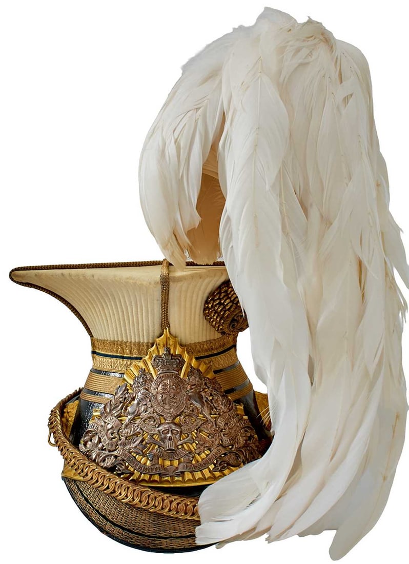 A VICTORIAN 17TH (DUKE OF CAMBRIDGE'S OWN) LANCER'S OFFICER'S CAP: A VICTORIAN 17TH (DUKE OF CAMBRIDGE'S OWN) LANCER'S OFFICER'S CAP the black leather body with bi-metal Victorian 17th Lancers rayed helmet plate, crowned Royal arms surmounting scroll banner battle ho