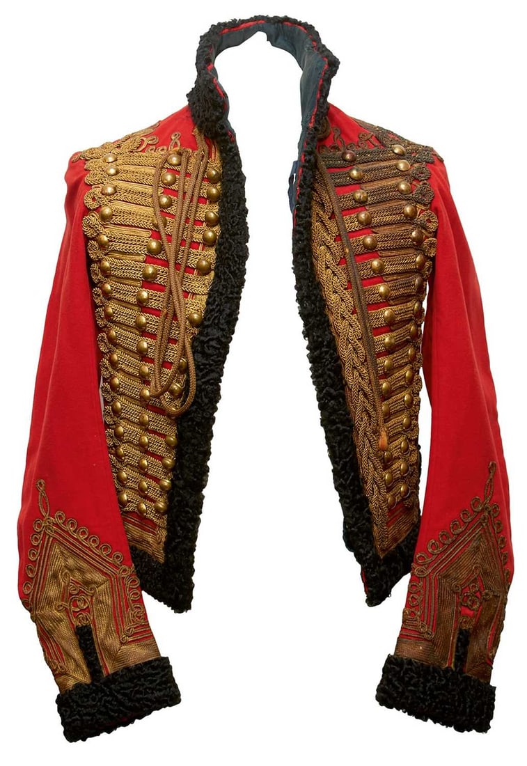 A WIVR 15TH HUSSARS OFFICER'S PELISSE,: A WIVR 15TH HUSSARS OFFICER'S PELISSE, the red cloth body with bullion ribbon trimmed cuffs, bordered and infilled with fine bullion scrolls, these and the collar and breast facings trimmed in wool, t