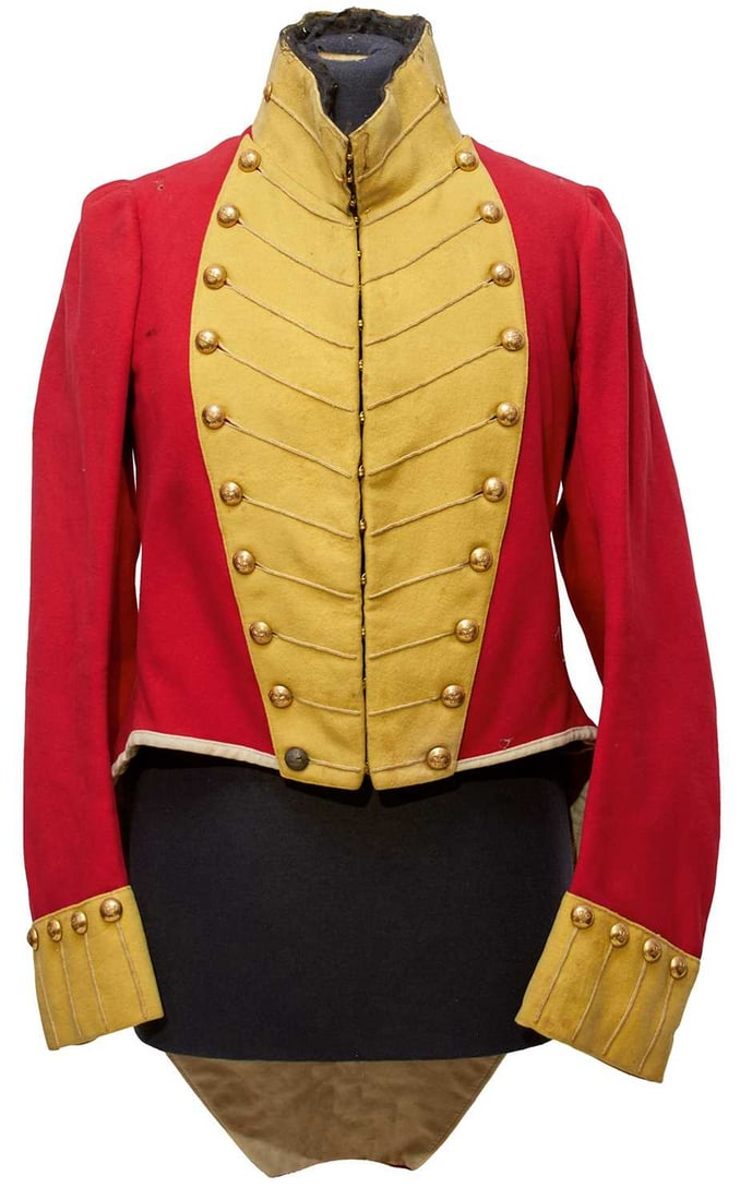 A SCARCE GEORGIAN PERIOD 2ND WEST INDIES REGIMENT OFFICER'S COATEE,: A SCARCE GEORGIAN PERIOD 2ND WEST INDIES REGIMENT OFFICER'S COATEE, the scarlet cloth body with yellow collars, cuffs and facings, full complement of regimental buttons, white cloth trimmed tails with