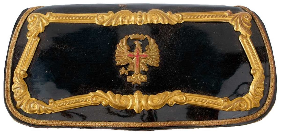 A SPANISH NATIONALIST OFFICER'S SHOULDER BELT AND POUCH,: A SPANISH NATIONALIST OFFICER'S SHOULDER BELT AND POUCH, the patent black leather flap with gilt brass er and central red enamel and gilt badge, red leather and cloth covered pouch, the leather backed