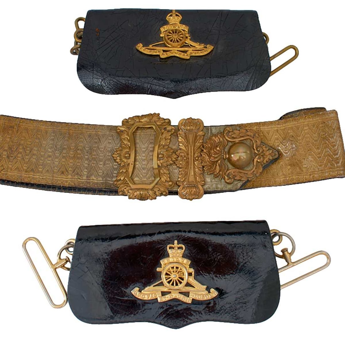 A ROYAL ARTILLERY OFFICER'S SHOULDER BELT AND POUCH,: A ROYAL ARTILLERY OFFICER'S SHOULDER BELT AND POUCH, the patent leather pouch applied with the gilt brass regimental badge, bullion cross belt with brass acanthus mounts, together with a further EIIR 