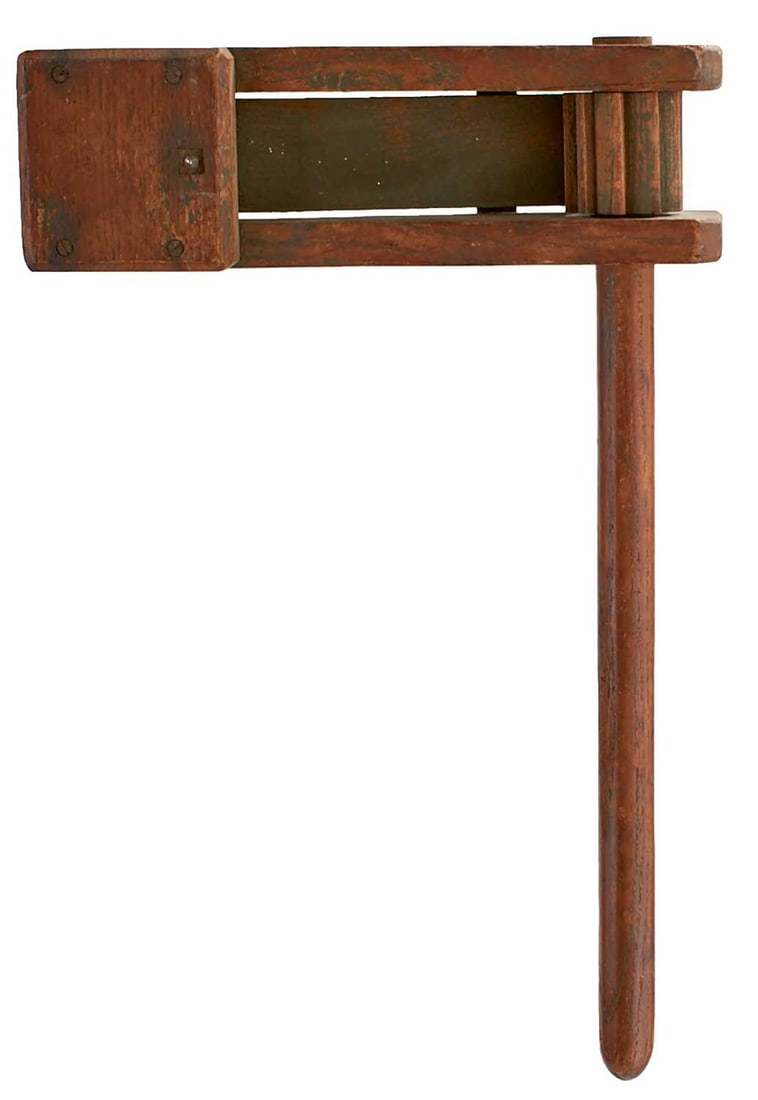 A FIRST WAR PERIOD GERMAN TRENCH ALARM OR GAS RATTLE,: A FIRST WAR PERIOD GERMAN TRENCH ALARM OR GAS RATTLE, the cylindrical wooden haft with rattle top, the latter with traces of field grey paint.