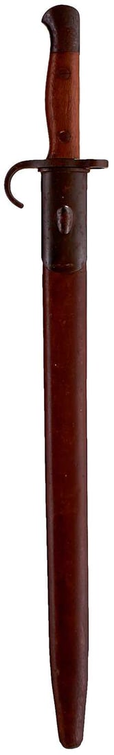 A 1907 PATTERN HOOKED QUILLON BAYONET,: A 1907 PATTERN HOOKED QUILLON BAYONET, 43cm fullered blade by Enfield dated 10, 08. regulation hilt with two-piece wooden grips, the pommel with regimental stamps W. RID over R. 636 (West Riding