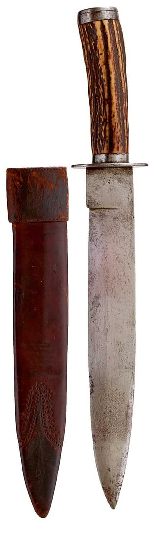 AN INDIAN BOWIE OR HUNTING KNIFE,: AN INDIAN BOWIE OR HUNTING KNIFE, 27.5cm blade, double edged towards the tip, characteristic hilt with ovoid steel crossguard, steel pommel cap, natural stag's horn grip, in its tooled leather scabbar