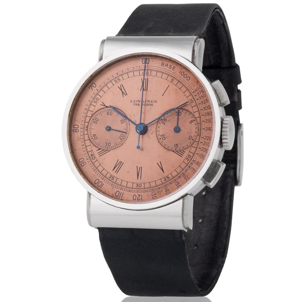 Longines. Very Fine and Unusual 13ZN Flyback: Longines. Very Fine and Unusual 13ZN Flyback Chronograph Wristwatch in Steel, Hooded Lugs, Pink tachymetric Scale Dial Model: Chronograph Coin Artist or Maker: Longines