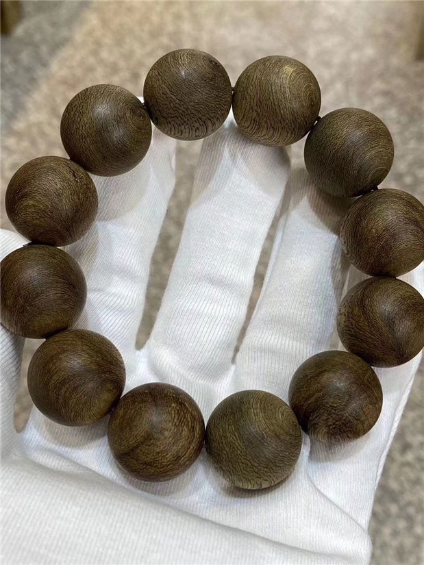 A Chinese Carved Agar-Wood Buddha Bead (1 of 4)