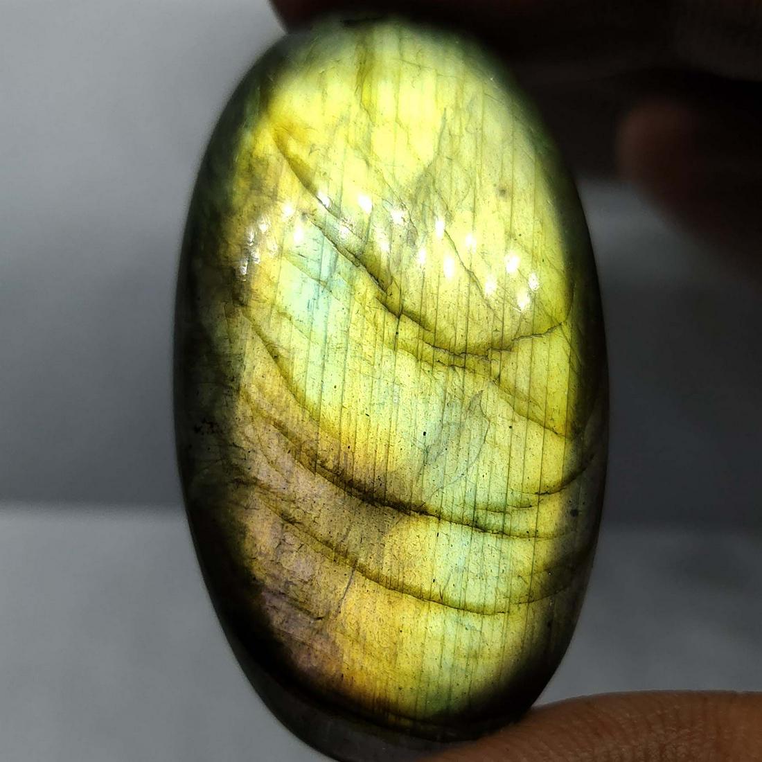 64.05 Ct Natural Green Labradorite: Natural Green Labradorite with an exact weight is 64.05 ct.AAA Quality stone