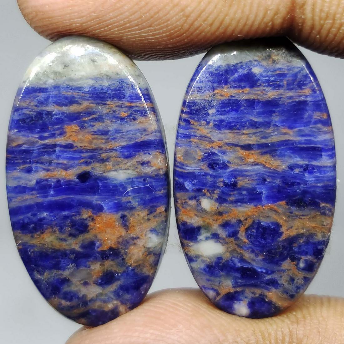 29.20 ct Natural Sodalite Pair: All the stones listed are 100% natural and rarely selected from a big quantity lot also these are of very high quality. BID WITH CONFIDENCE!!! DIMENSIONS : 26X14X4 mm