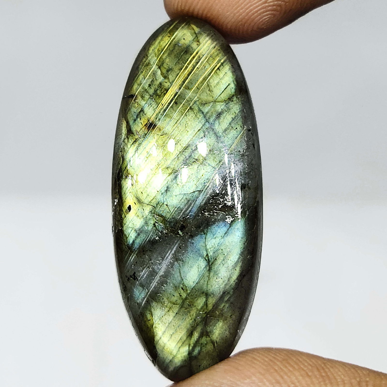 47.50 ct Natural Multi Labradorite: All the stones listed are 100% natural and rarely selected from a big quantity lot also these are of very high quality. BID WITH CONFIDENCE!!! DIMENSIONS : 41.57X17.07X7.40 mm