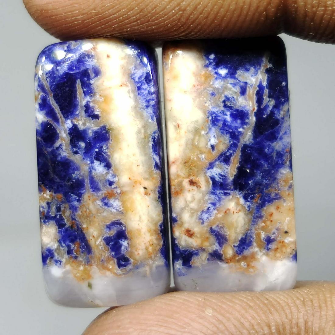 25.45 ct Natural Sodalite Pair: All the stones listed are 100% natural and rarely selected from a big quantity lot also these are of very high quality. BID WITH CONFIDENCE!!! DIMENSIONS : 24X11X4 mm