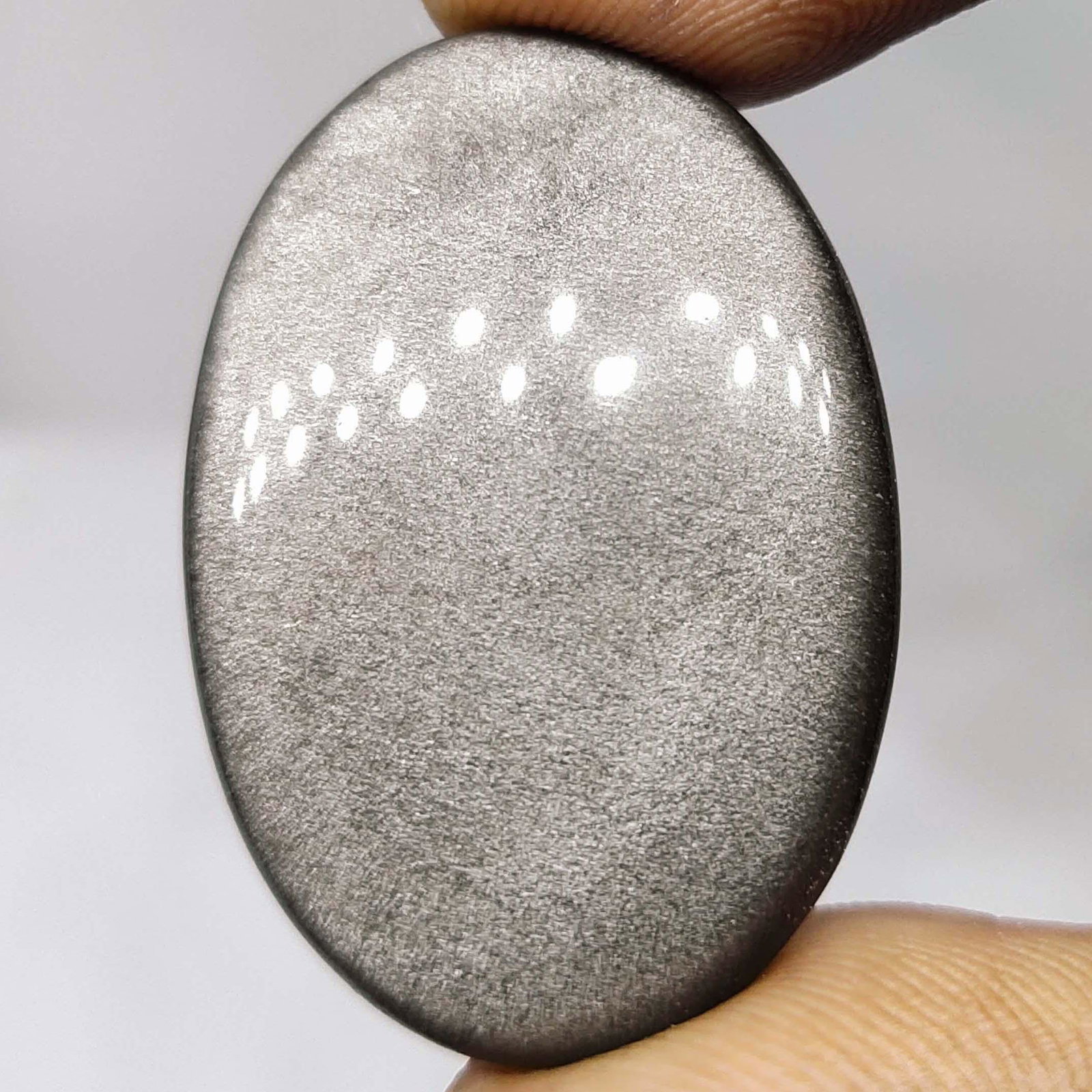 31.65 ct Natural Silver Obsidian: All the stones listed are 100% natural and rarely selected from a big quantity lot also these are of very high quality. BID WITH CONFIDENCE!!! DIMENSIONS : 33X23X6 mm