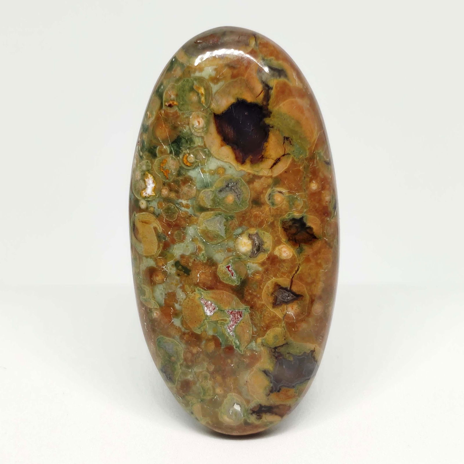 61.30 ct Natural Rain Forest Rhyolite Jasper: All the stones listed are 100% natural and rarely selected from a big quantity lot also these are of very high quality. BID WITH CONFIDENCE!!! DIMENSIONS : 46X23X7 mm