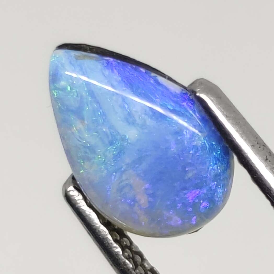 0.95 ct Australian Doublet Opal: Gemstones: Australian Doublet OpalCarat Weights: 0.95 ct Size/Dimensions: 9 X 6 mm