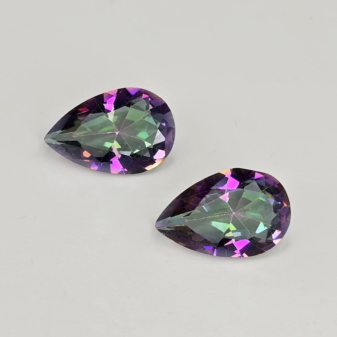 4.74 ct Rainbow Mystic Quartz Pair: Gemstones: Mystic Quartz /Carat Weights: 4.74 ct /Size or Dimensions: 12 X 8 X 5 mm /Treatment: Coated