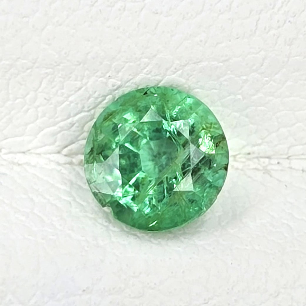 0.59 ct Natural Zambian Emerald Round: Gemstones: Natural Emerald /Carat Weights: 0.59 ct /Size or Dimensions: 5.20 mm Approx /Treatment : Colorless Oil