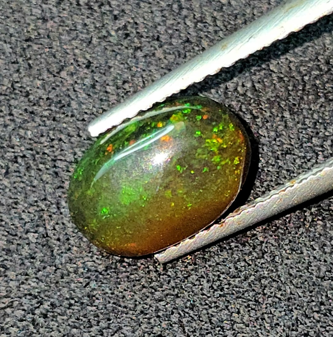 1.52 Ct "Play Of Colors" Natural Black Opal: Gemstones: Natural Black Fire Opal /Carat Weights: 1.52 ct /Size or Dimensions: 10 X 6.70 X 3.70 mmTreatment: Heated
