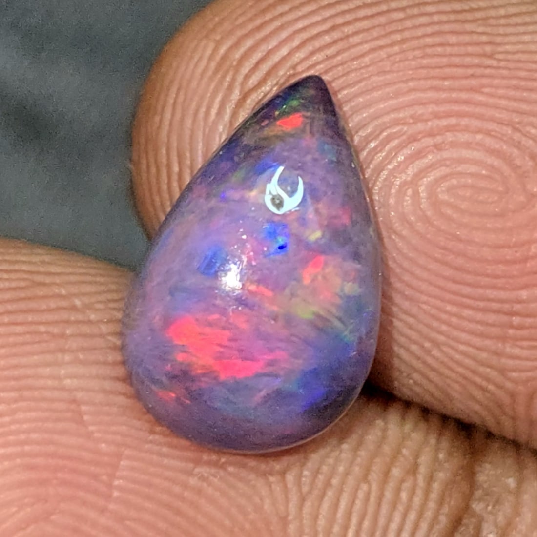 2.01 Ct "Play Of Colors" Natural Black Opal: Gemstones: Natural Black Fire Opal /Carat Weights: 2.01 ct /Size or Dimensions: 12.40 X 8 X 4.50 mmTreatment: Heated