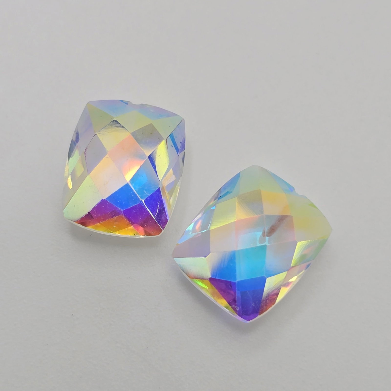 9.68 ct Natural Mercury Glow Mystic Topaz Drilled Pair: Gemstones: Natural Mystic Topaz /Carat Weights: 9.68 ct /Size or Dimensions: 12 X 10 X 5.50 mm /Treatment: Coated
