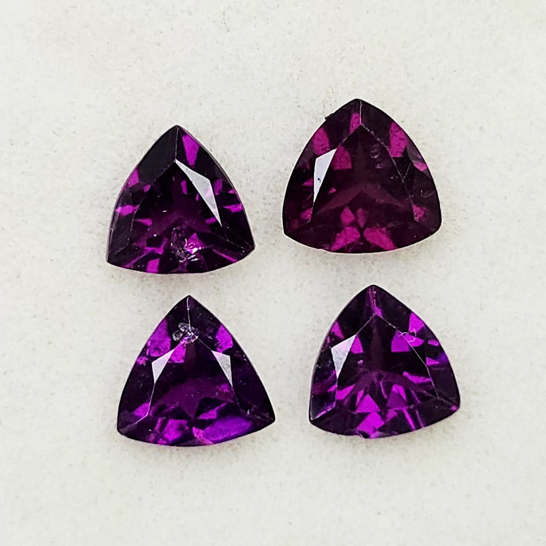 1.96 Ct Natural Rhodolite Garnet Trillion Set: Gemstones: Rhodolite Garnet /Carat Weights: 1.96 ct /Size or Dimensions: 5 mm /