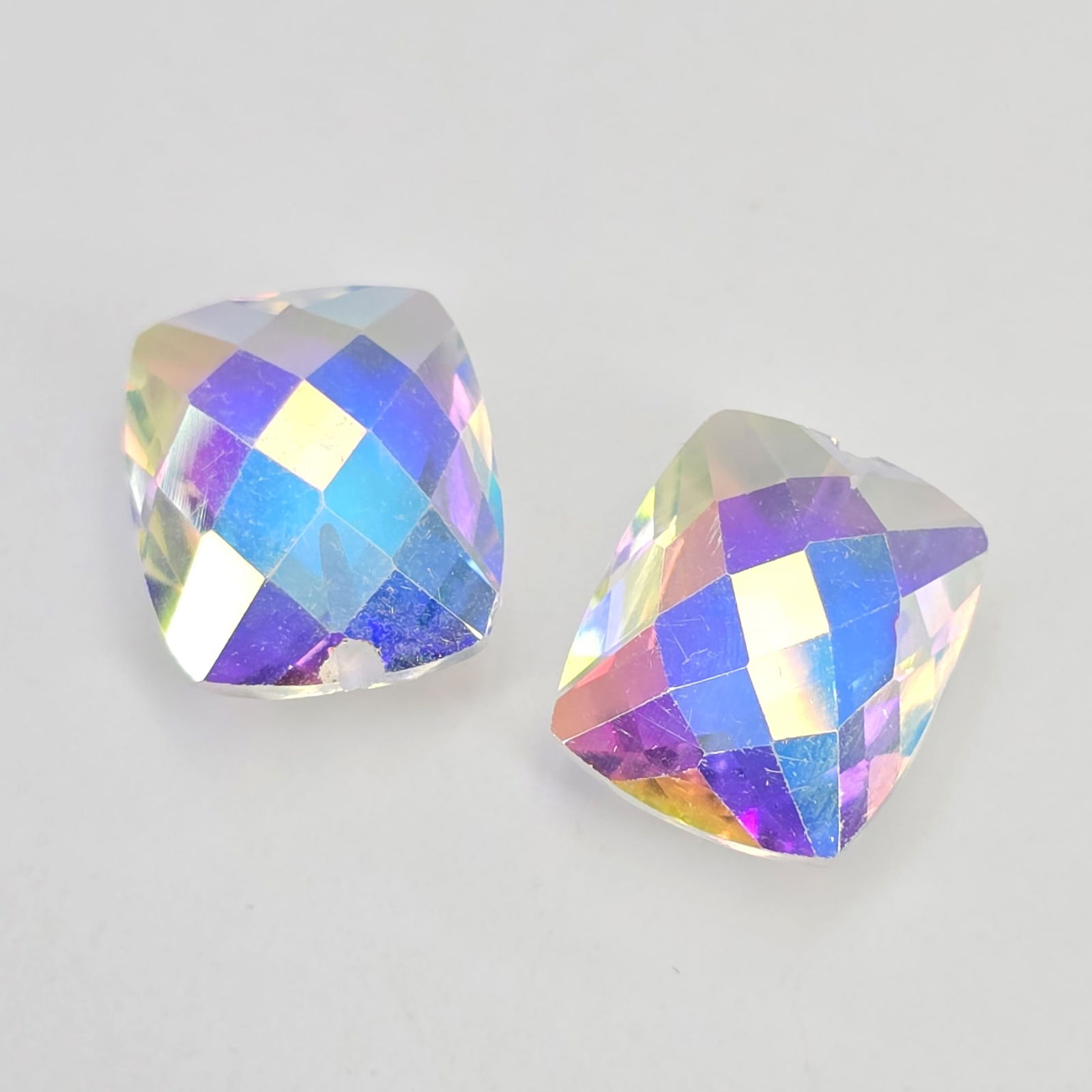 8.97 ct Natural Mercury Glow Mystic Topaz Drilled Pair: Gemstones: Natural Mystic Topaz /Carat Weights: 8.97 ct /Size or Dimensions: 12 X 10 mm /Treatment: Coated