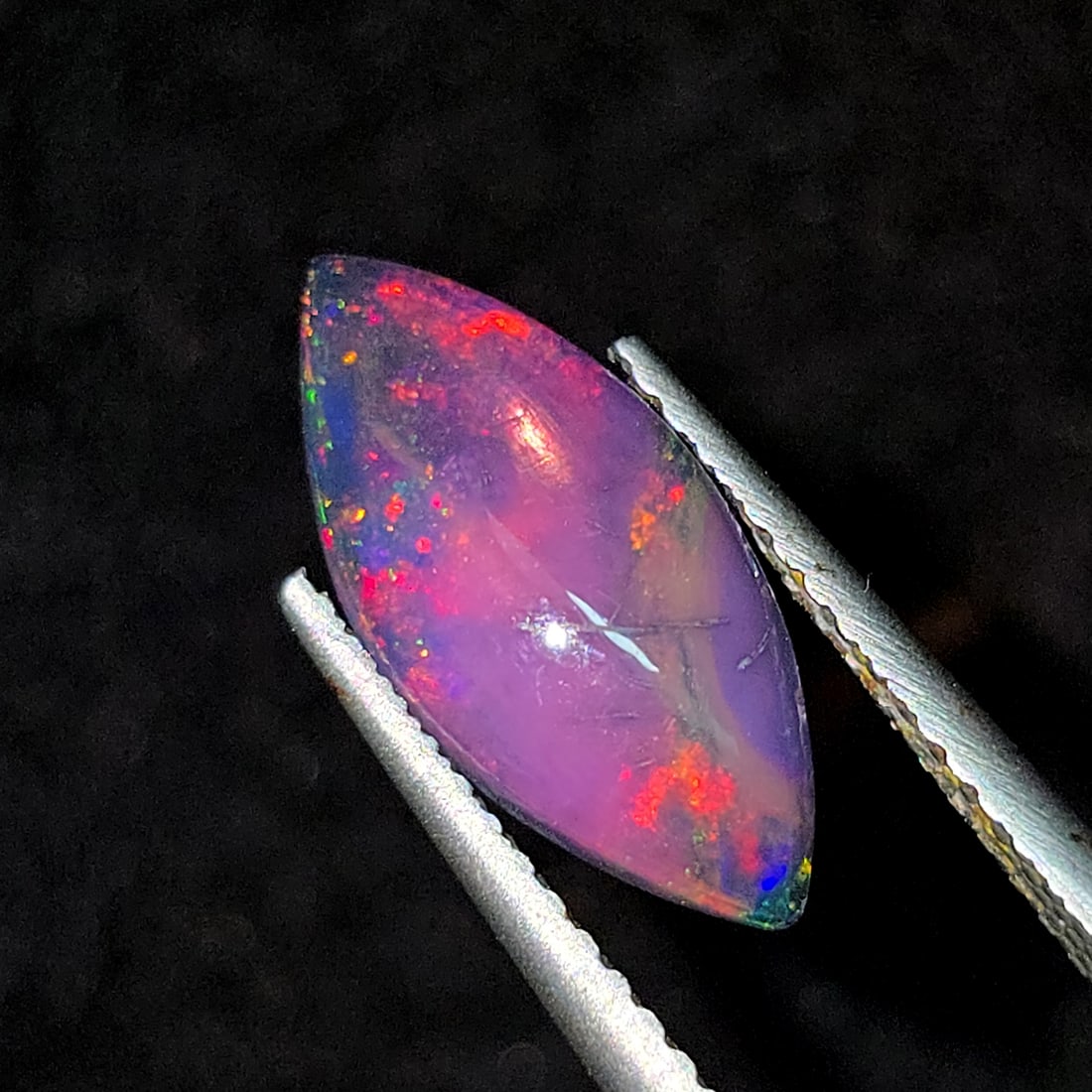 1.24 Ct "Play Of Colors" Natural Black Opal: Gemstones: Natural Black Fire Opal /Carat Weights: 1.24 ct /Size or Dimensions: 14.20 X 6.50 X 3 mmTreatment: Heated