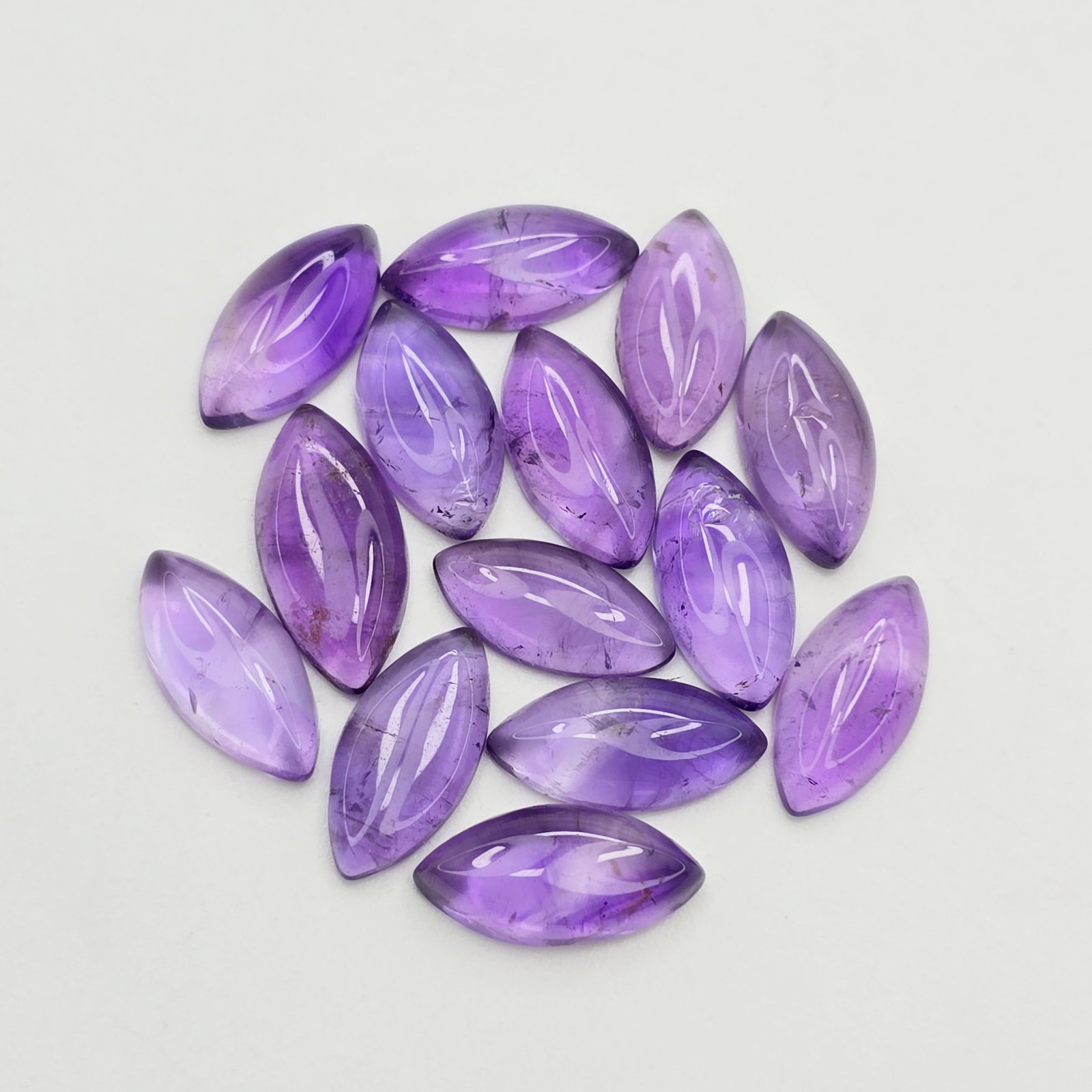22.47 ct Natural African Amethyst Cab Marquise Set: Gemstones: Natural African Amethyst /Carat Weights: 22.47 ct /Size or Dimensions: 12 X 6 mm /Origin : Africa