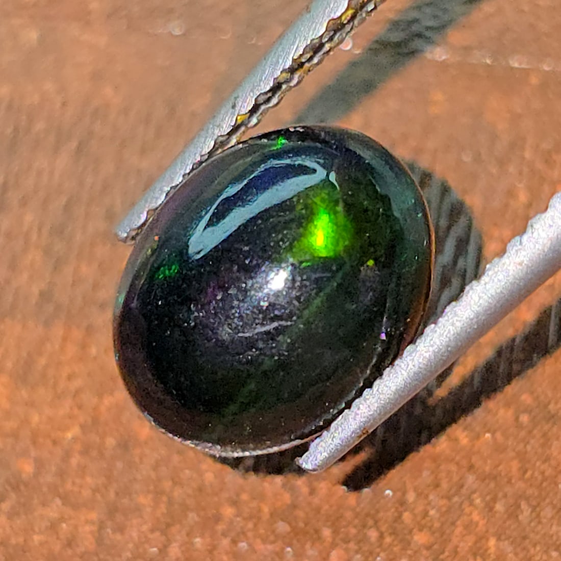 1.72 Ct "Play Of Colors" Natural Black Opal: Gemstones: Natural Black Fire Opal /Carat Weights: 1.72 ct /Size or Dimensions: 10.20 X 8 X 4 mmTreatment: Heated